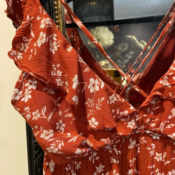 Burnt orange floral romper with ruffles and crisscross back (adjustable) - Picture 2 of 7